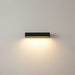 Modern wall-mounted light fixture on a plain wall