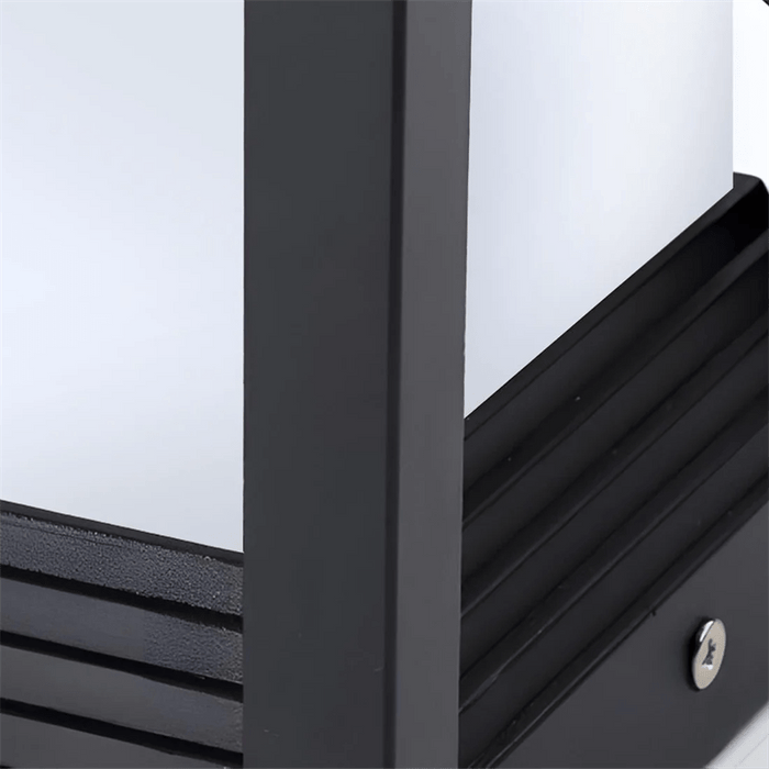Close-up of a black metal cabinet with a white interior