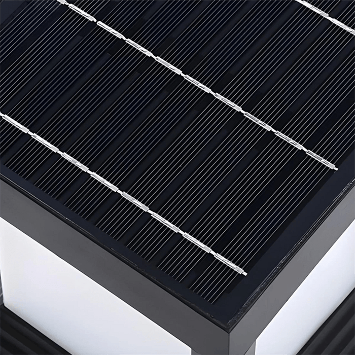 Close-up of a solar panel with black surface and white frame