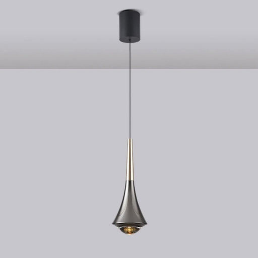 Modern pendant light with a black and gold design on a plain background