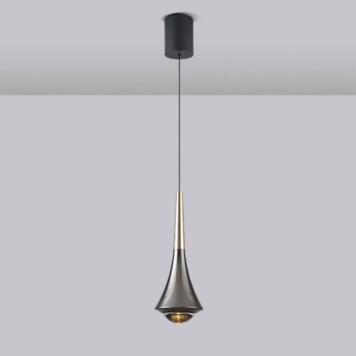 Modern pendant light with a black and gold design on a plain background