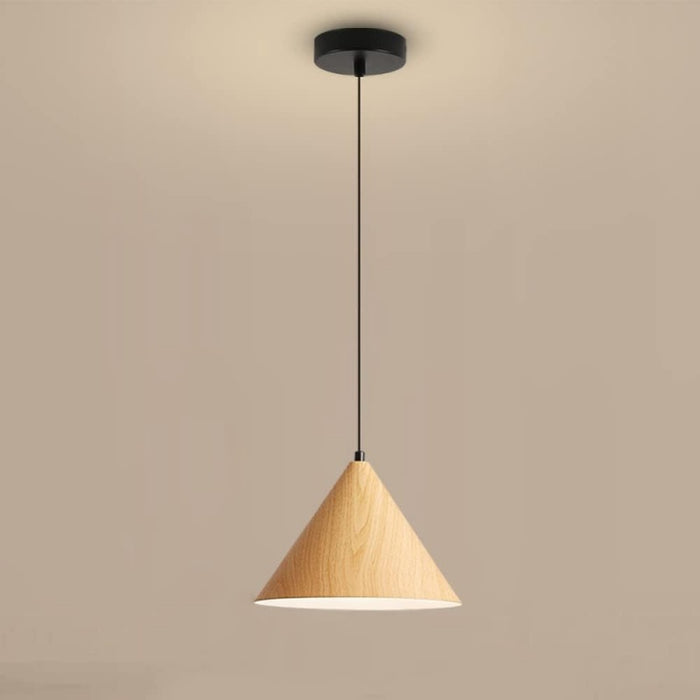Wooden pendant light against a beige background