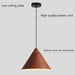 Wooden pendant light with labeled iron ceiling plate, high quality power cord, and walnut color iron lampshade on a gray background.
