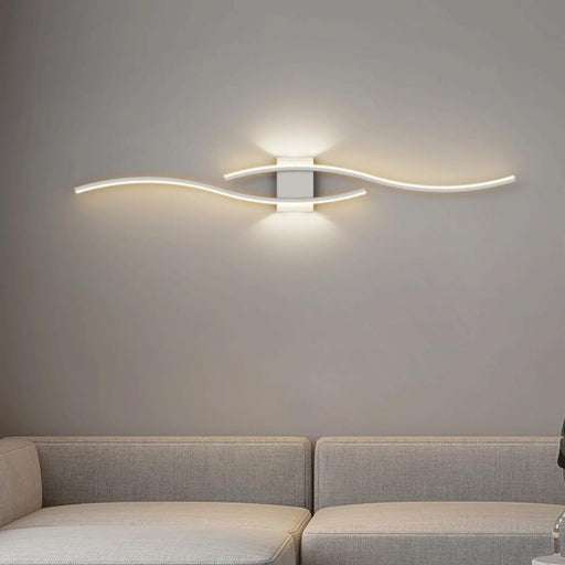 Modern wall light fixture on a gray wall above a sofa