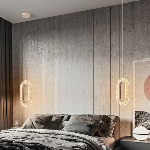 Modern bedroom with gray walls, a bed, and hanging lights.