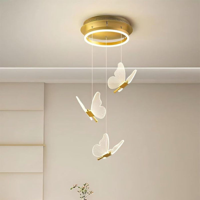 Ceiling light fixture with butterfly-shaped lamps on a neutral background
