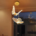 Bird-shaped pendant light hanging in a room with a blurred background