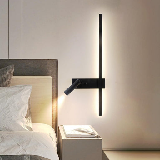 Modern wall-mounted light fixture in a bedroom setting.