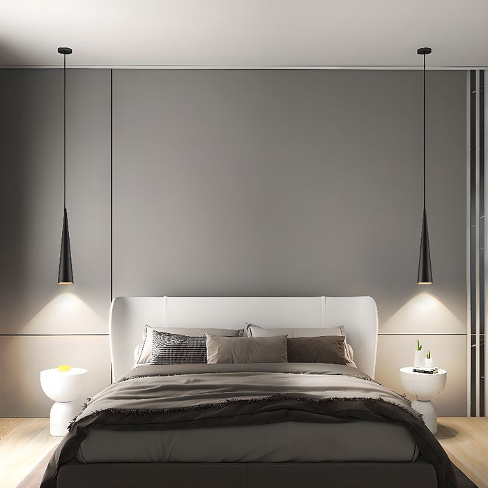 Modern bedroom with a bed, nightstands, and pendant lights against a gray wall.