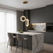 Modern kitchen with marble island, gray bar stools, and pendant lights.