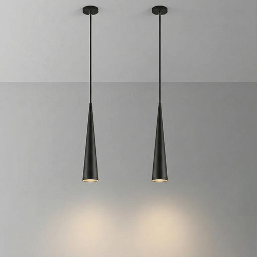Two black pendant lights hanging against a gray background