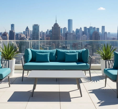 Blue outdoor furniture set on a rooftop with city skyline in the background