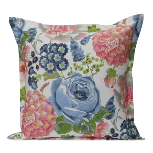 Floral patterned pillow with blue, pink, and green flowers on a white background