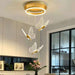 Modern ceiling light fixture with butterfly designs in a home setting