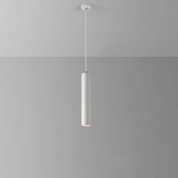White pendant light hanging against a gray background