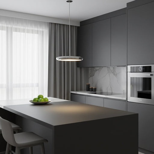 Modern kitchen with gray cabinets, island, and pendant light.