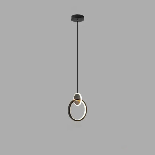 Modern pendant light with circular design on a gray background