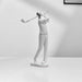 White sculpture of a golfer on a white background