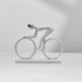 White bicycle-shaped decorative object on a gray background