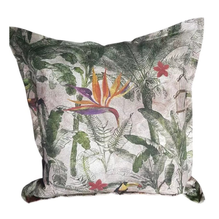 Decorative pillow with tropical leaf and flower pattern on a white background